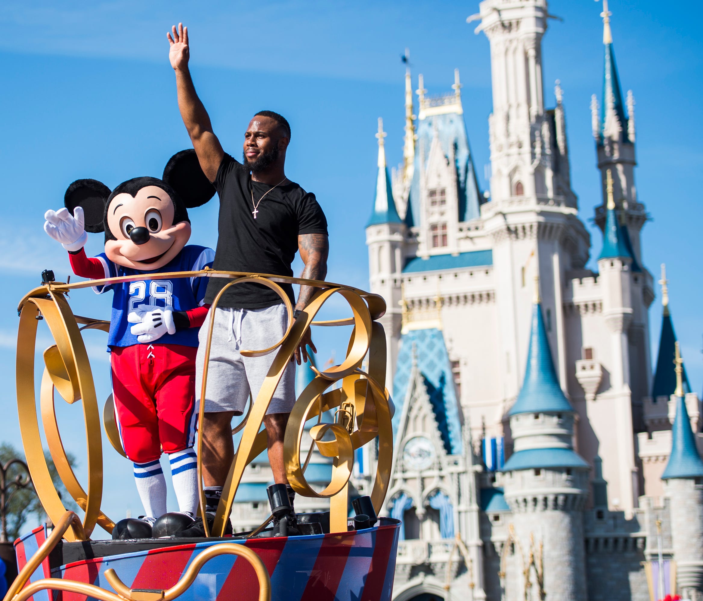 The company behind Mickey Mouse, shown here with running back James White of the New England Patriots on Feb. 6, 2017, at Walt Disney World in Buena Vista, Fla., increased security before the Oct. 1, 2017, Las Vegas shootings but likely will look for