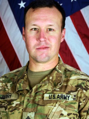 This undated file photo provided by the Fort Hood, Texas Press Center shows U.S. Army Sgt. John W. Perry of Stockton, Calif. Stewart Perry, the father of a soldier recently killed in Afghanistan says he felt disrespected and hurt by passengers who booed him and his family when they were on a flight that was running late to meet his son's remains and passengers were asked to remain seated so they could deplane first. Perry's son, 30-year-old Sgt. John Perry, of Stockton, California, died of injuries inflicted by an improvised explosive device attack Nov. 12, 2016, inside Bagram Airfield.