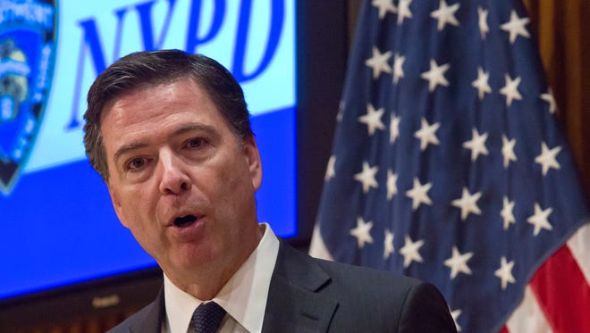 FBI Director James Comey speaks during a press conference after addressing the NYPD Shield Conference at NYPD headquarters, Wednesday, Dec. 16, 2015, in New York. Comey says the husband-and-wife team who killed 14 and wounded 21 others this month in San Bernardino, California, exchanged private direct messages and there has been no evidence to suggest the couple posted on social media. (AP Photo/Bebeto Matthews)