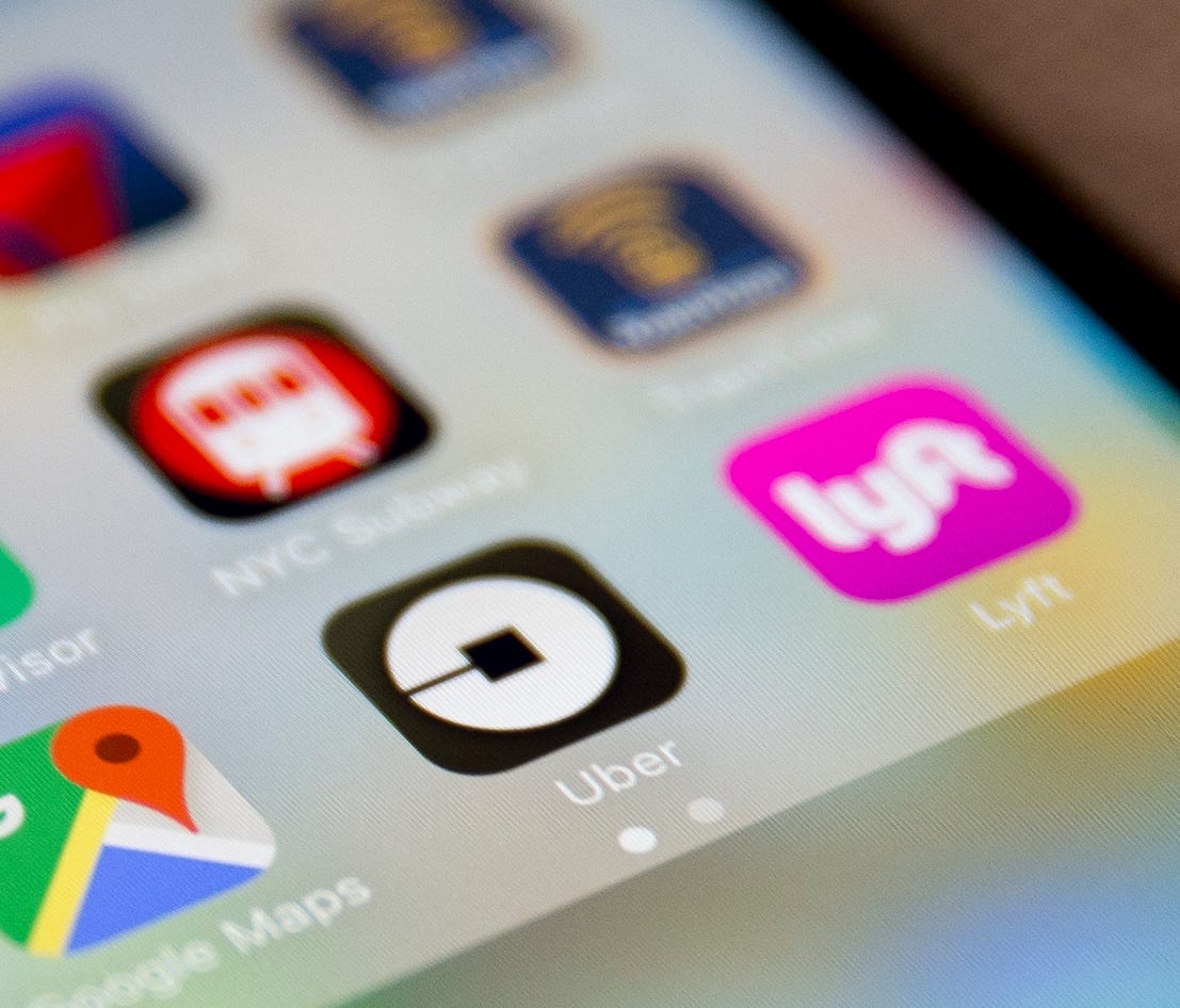 The Uber app icon is displayed on an iPhone in New York. A new feature on the ride-hailing app, which is coming out Tuesday, aims at making it easier for its users to set up trips for other people who don't know their way around a smartphone and need