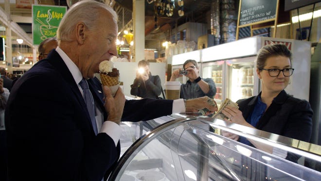 Vice President Joe Biden, left, enjoys a double scoop ice cream cone from Jeni Britton Bauer, owner of Jeni's Ice Cream, during a brief stop at North Market in downtown Columbus in January 2012.