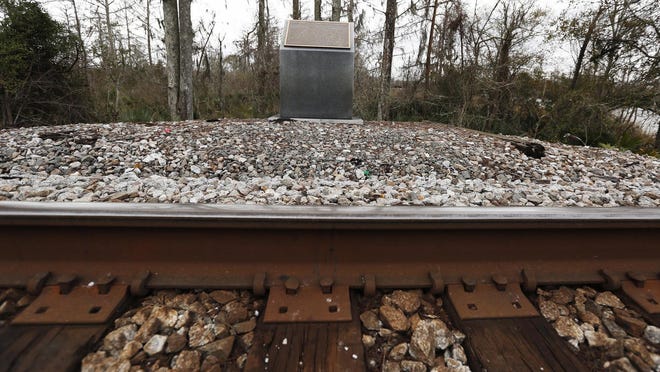 A monument is displayed in Spanish Fort, Ala., next to a railroad track near a bridge over the Big Bayou Canot, erected in memoriam of one of Amtrak's worst tragedies. The Sunset Limited passenger train derailed at the site in 1993, killing 47 people and injuring more than 100 others.