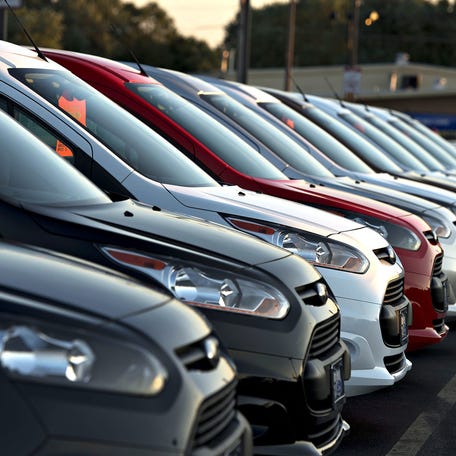   Ford 2014 Transit Connect vehicles sit on the lot at the Rob Baker Ford dealership in Plainfield, Ill., in July 23.  