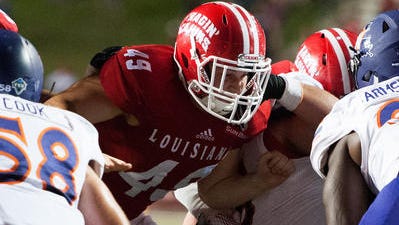 UL snapper Stephen Morella blocks during a 2015 win over Northwestern State at Cajun Field.