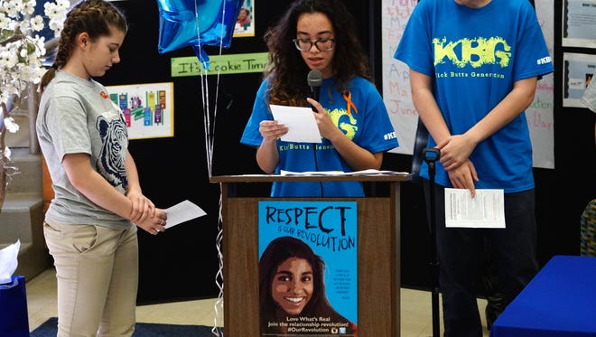 Fourteen-year-old Gabriela Nieves, an eighth-grader at Shue-Medill Middle School, speaks to her classmates and officials attending an event where Gov. John Carney signed a proclamation declaring it Teen Dating Violence Awareness Month.