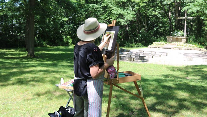 Dee Baker, a longtime Lakesider originally from Toledo, works on en plein air pastel painting on Saturday.