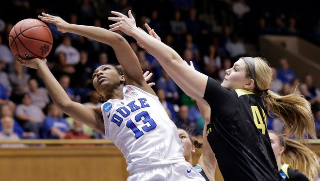 Duke's Crystal Primm (13) drives to the basket while Oregon's Mallory McGwire defends during the first half of a second-round game in the NCAA women's college basketball tournament in Durham, N.C., Monday, March 20, 2017. (AP Photo/Gerry Broome)
