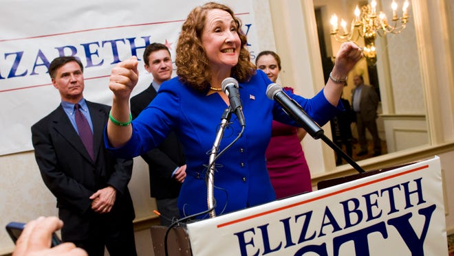 Rep. Elizabeth Esty, D-Conn., addresses supporters in front of her husband and children at CoCo Key in Waterbury, Conn., Nov. 4, 2014.