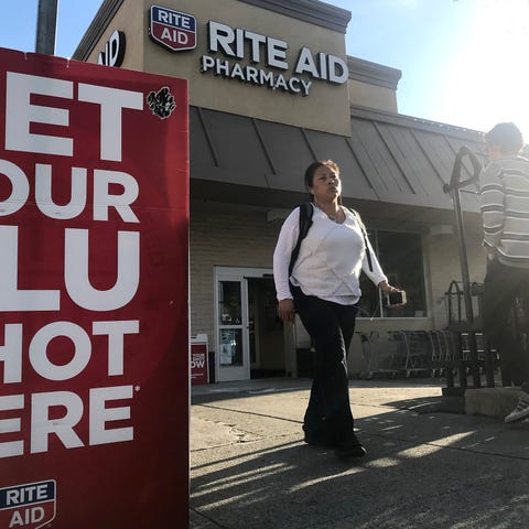 File photo taken in Jan. 2018 shows passersby near