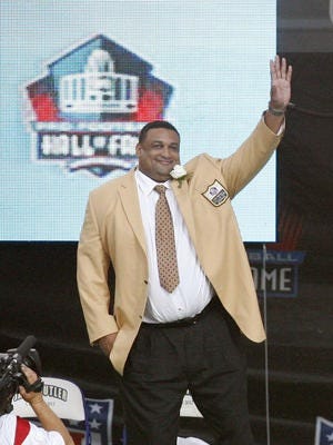 Former Louisiana Tech lineman Willie Roaf gestures to the crowd during the 2012 Pro Football Hall of Fame enshrinement ceremonies at Fawcett Stadium in Pittsburgh, Pennsylvania in 2012.