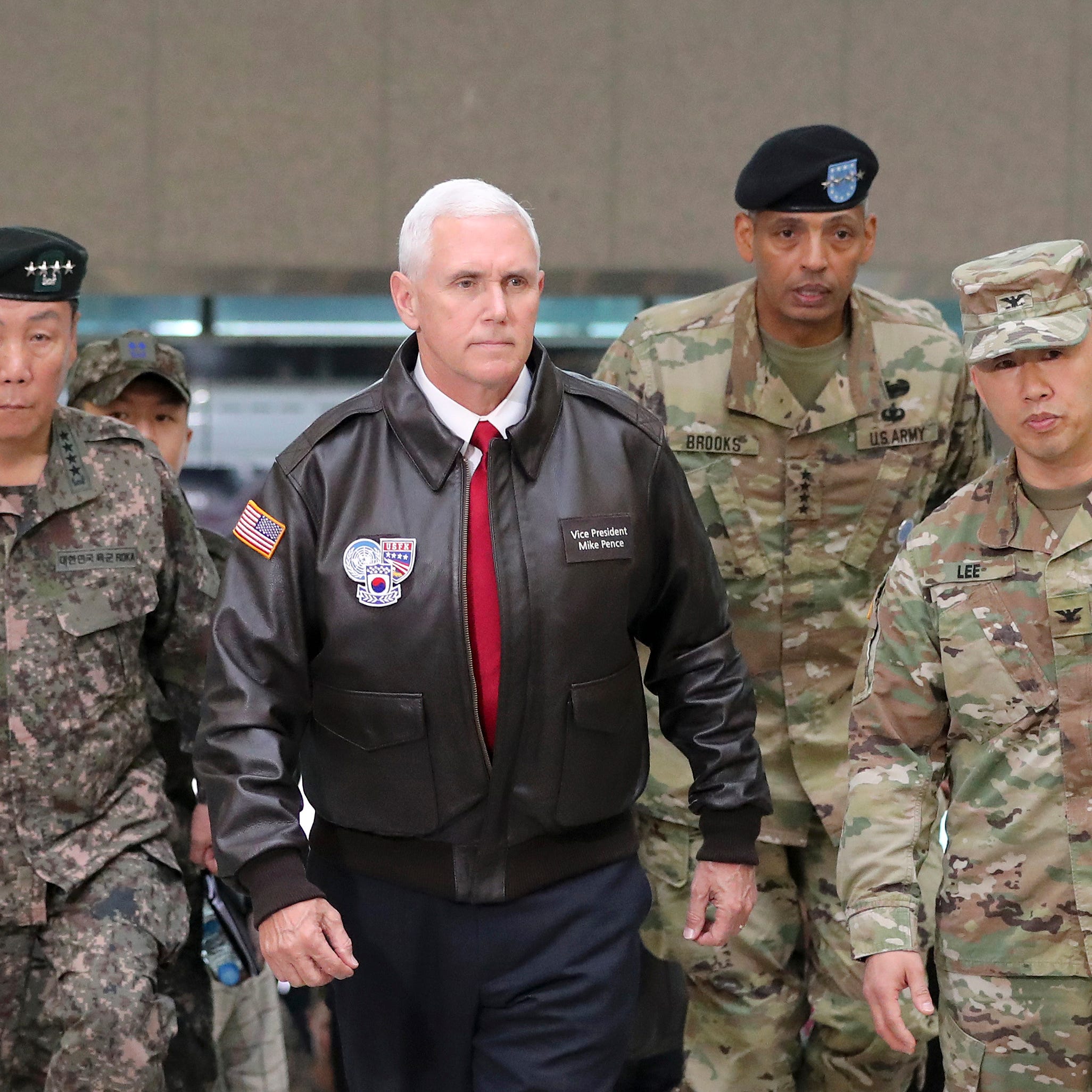 Vice President Pence arrives with U.S. Gen. Vincent Brooks, second from right, commander of the United Nations Command, U.S. Forces Korea and Combined Forces Command, and South Korean Deputy Commander of the Combined Force Command Gen. Leem Ho-young,