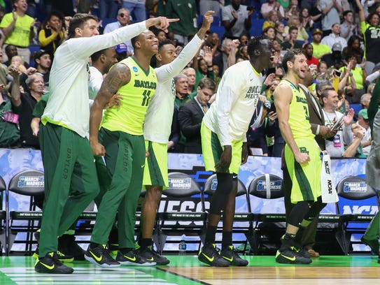 The Baylor bench celebrates during the second half