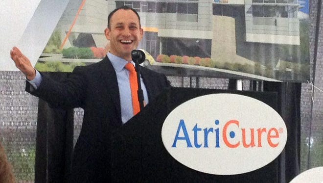 Atricure CEP Mike Carrel speaks to a crowd at the company’s groundbreaking ceremony of its new global headquarters in Mason on Aug. 25, 2014.