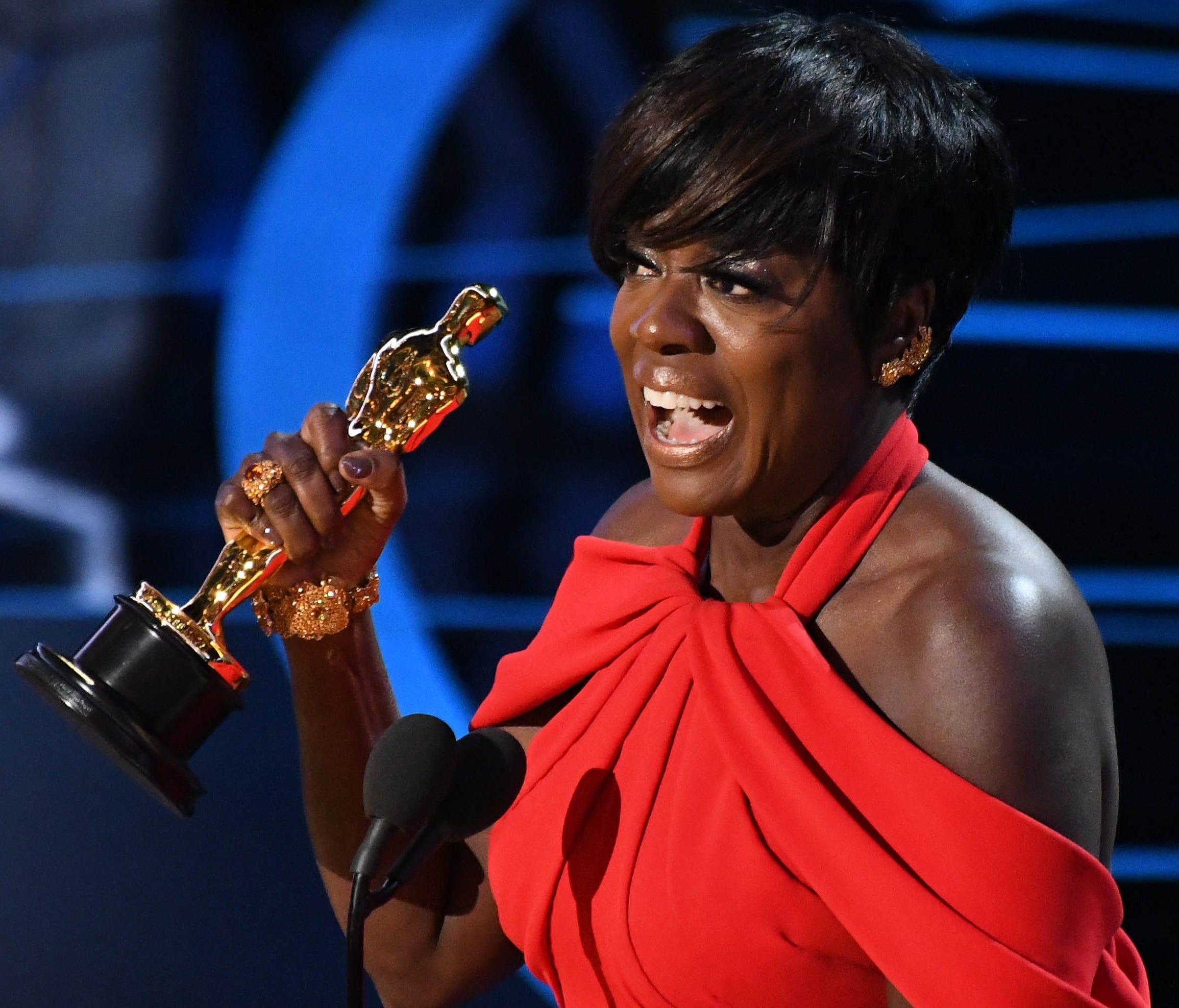 Viola Davis hoists the Oscar for Best Supporting Actress for her role in 'Fences.'