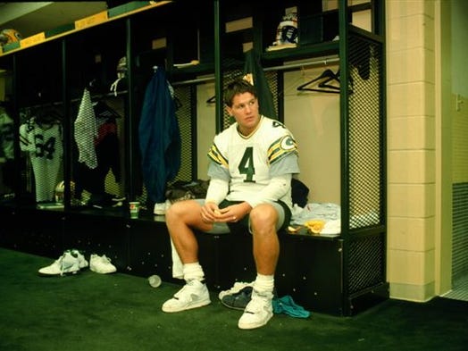 Brett Favre sits at his locker during the 1992 season,