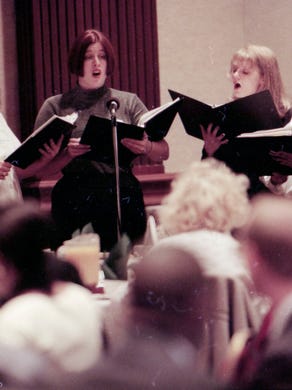 Members of the West High School chorus, from left, Christy Parks, Chyna Brackeen, Adrienne Nodell, and Talethia Gary perform YMCA/YWCAÕs Thanksgiving Prayer Breakfast at the Radisson Hotel in November 1996. 