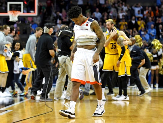 Virginia Cavaliers guard Nigel Johnson (23) reacts