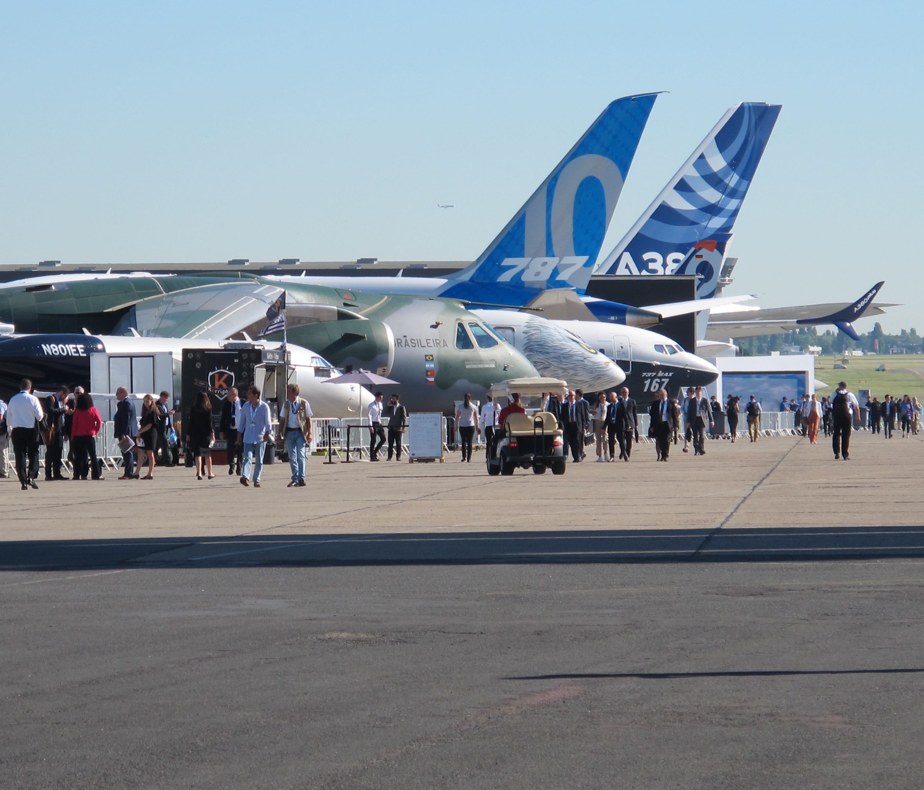 Visitors check out the line-up of planes on display Monday (June 19, 2017) at the Paris Air Show.