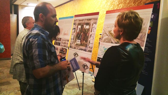 Mesa resident Augie Gastelum (left) discusses a City Center design with Michele Shelor, principal at Colwell Shelor Landscape Architecture.