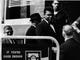 Muhammad Ali shakes hands with a man before entering