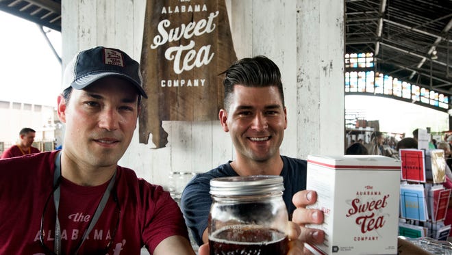 Golson Foshee, left, and Wes Willis display their Alabama Sweet Tea at the Southern Makers event held at the Union Station Train Shed in Montgomery, Ala., on Saturday April 30, 2016. 