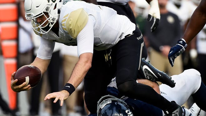 Baylor quarterback Seth Russell, left, is sacked by Rice defensive end Blain Padgett in the first half of an NCAA college football game, Friday, Sept. 16, 2016, in Houston. (AP Photo/Eric Christian Smith)