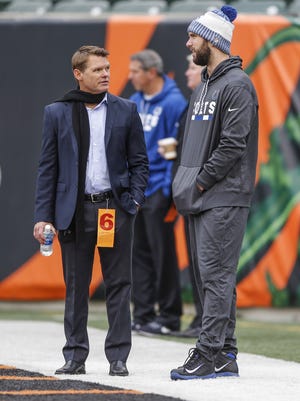 Indianapolis Colts general manager Chris Ballard talks with Colts quarterback Andrew Luck (12) before the Cincinnati Bengals game at Paul Brown Stadium in Cincinnati on Sunday, Oct. 29, 2017.