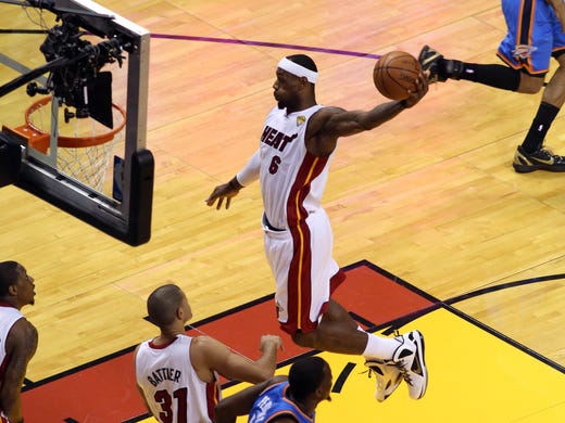 Miami Heat small forward LeBron James (6) dunks against