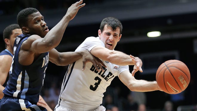 Butler guard Alex Barlow is pressured by Villanova guard Dylan Ennis in the first half of the game at Hinkle Fieldhouse on Saturday, Feb. 14, 2015. The Bulldogs lost to the Wildcats 65-68.