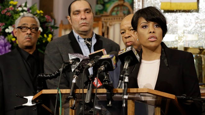 Baltimore Mayor Stephanie Rawlings-Blake speaks in front of faith and community leaders at a news conference Sunday.
