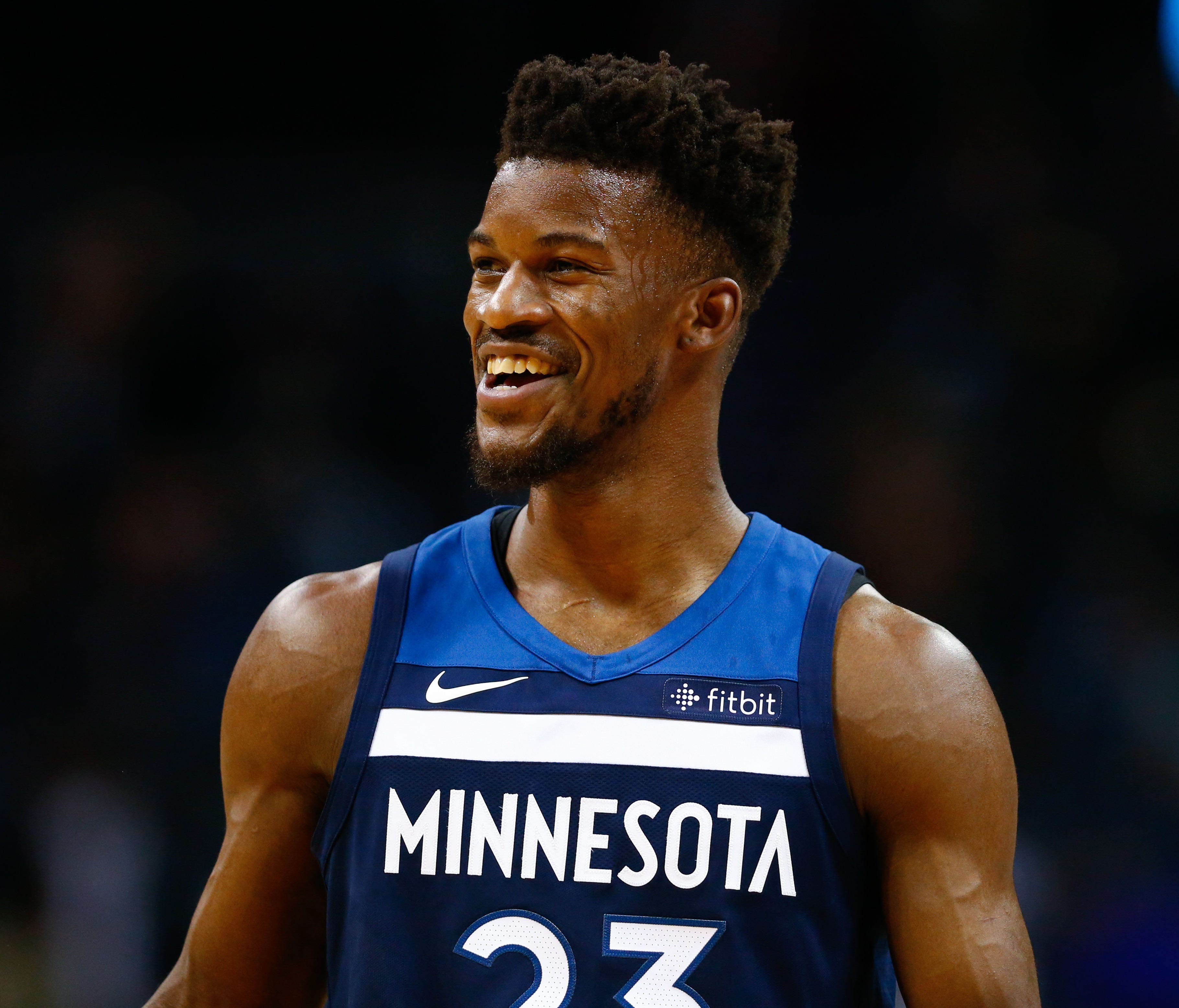 Minnesota Timberwolves guard Jimmy Butler (23) laughs during the second half against the Charlotte Hornets at Spectrum Center.