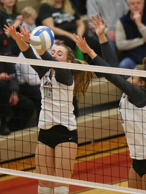 Novi’s Ally Cummings blocks a shot against Birmingham Marian in a Class A state quarterfinal on Tuesday at Troy Athens.