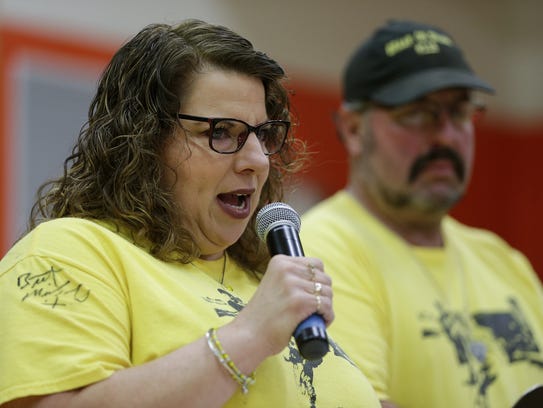 Dillon's mother Angel Mueller speaks before the signing