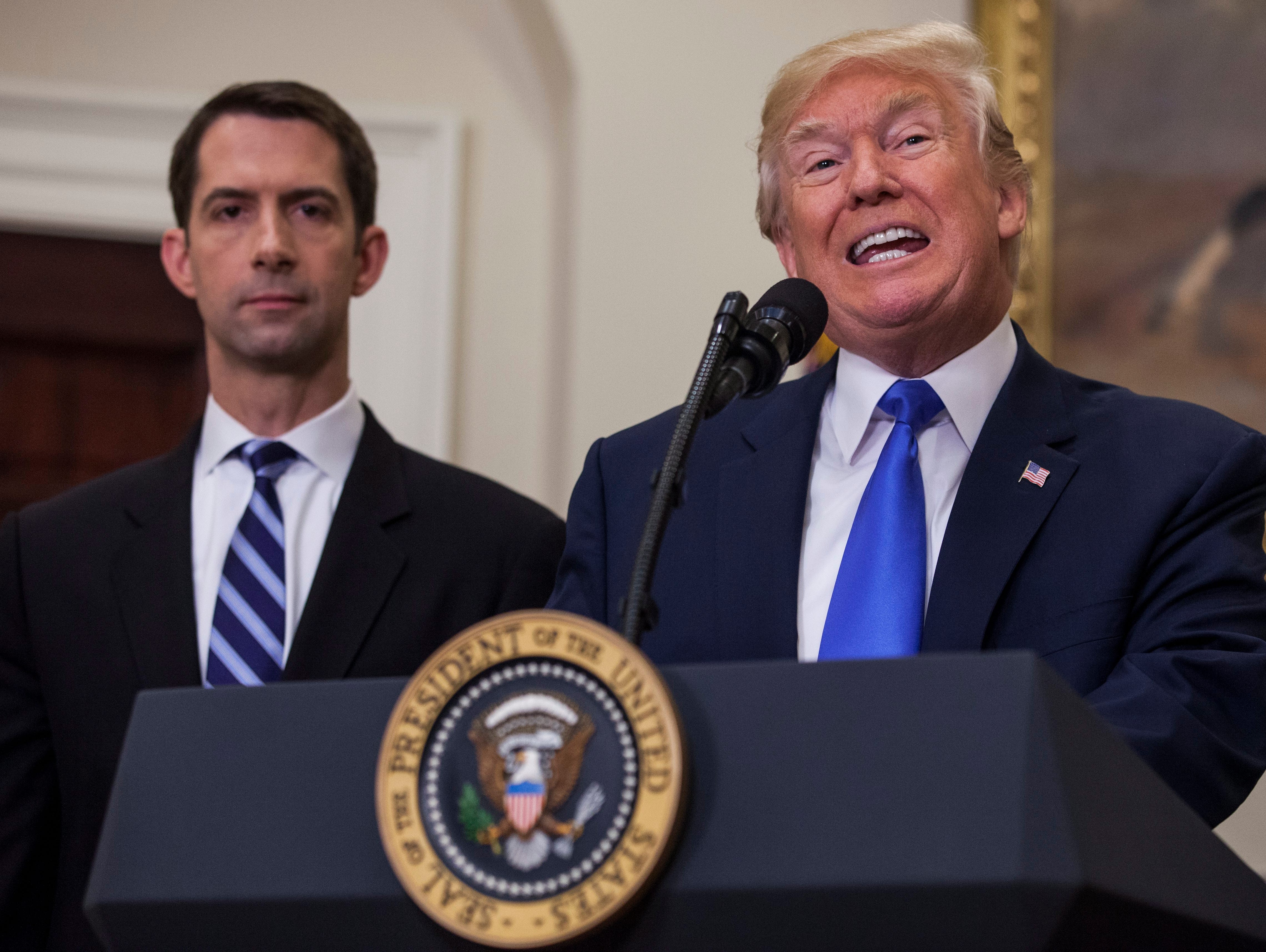 President Trump endorses the Reforming American Immigration for Strong Employment (RAISE) Act with Republican Senator from Arkansas, Tom Cotton (L), and Republican Senator from Georgia. David Perdue (out of frame), in the Roosevelt Room of the White 