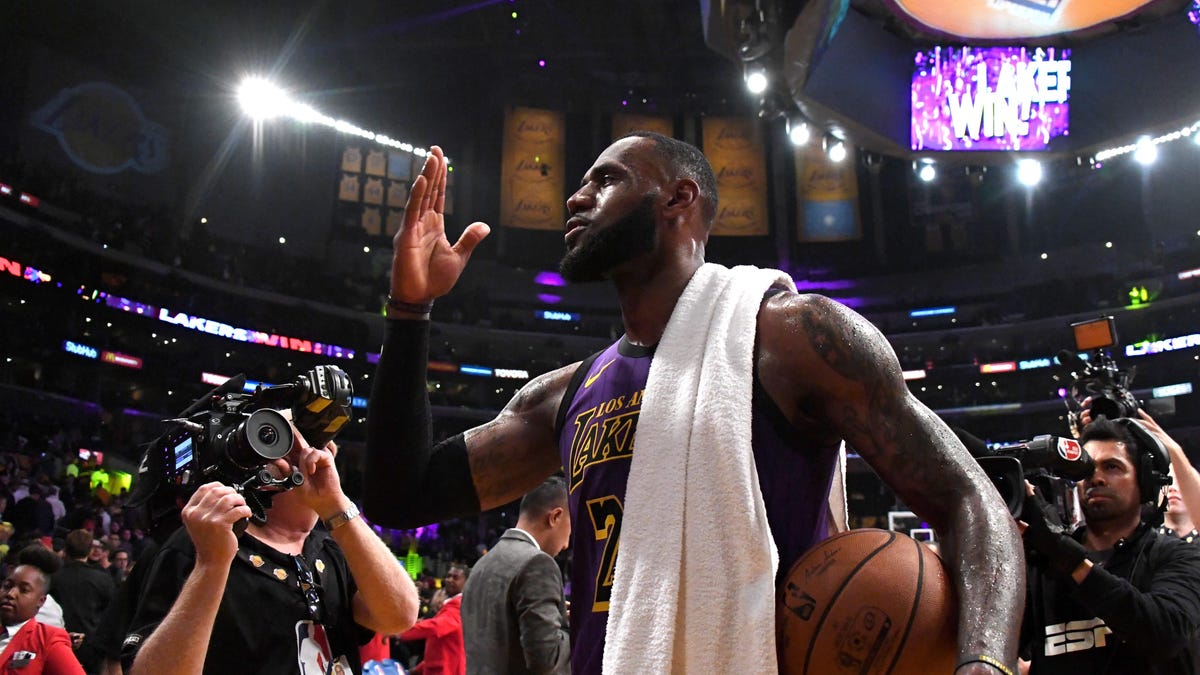 Nov 14, 2018; Los Angeles, CA, USA;  Los Angeles Lakers forward LeBron James (23) walks off the  court with the game ball after the game against the Portland Trail Blazers at Staples Center. The Lakers defeated the Trail Blazers 126-117. James scored 44 points to surpass Wilt Chamberlain to move into fifth on the all-time career NBA scoring list. Mandatory Credit: Kirby Lee-USA TODAY Sports