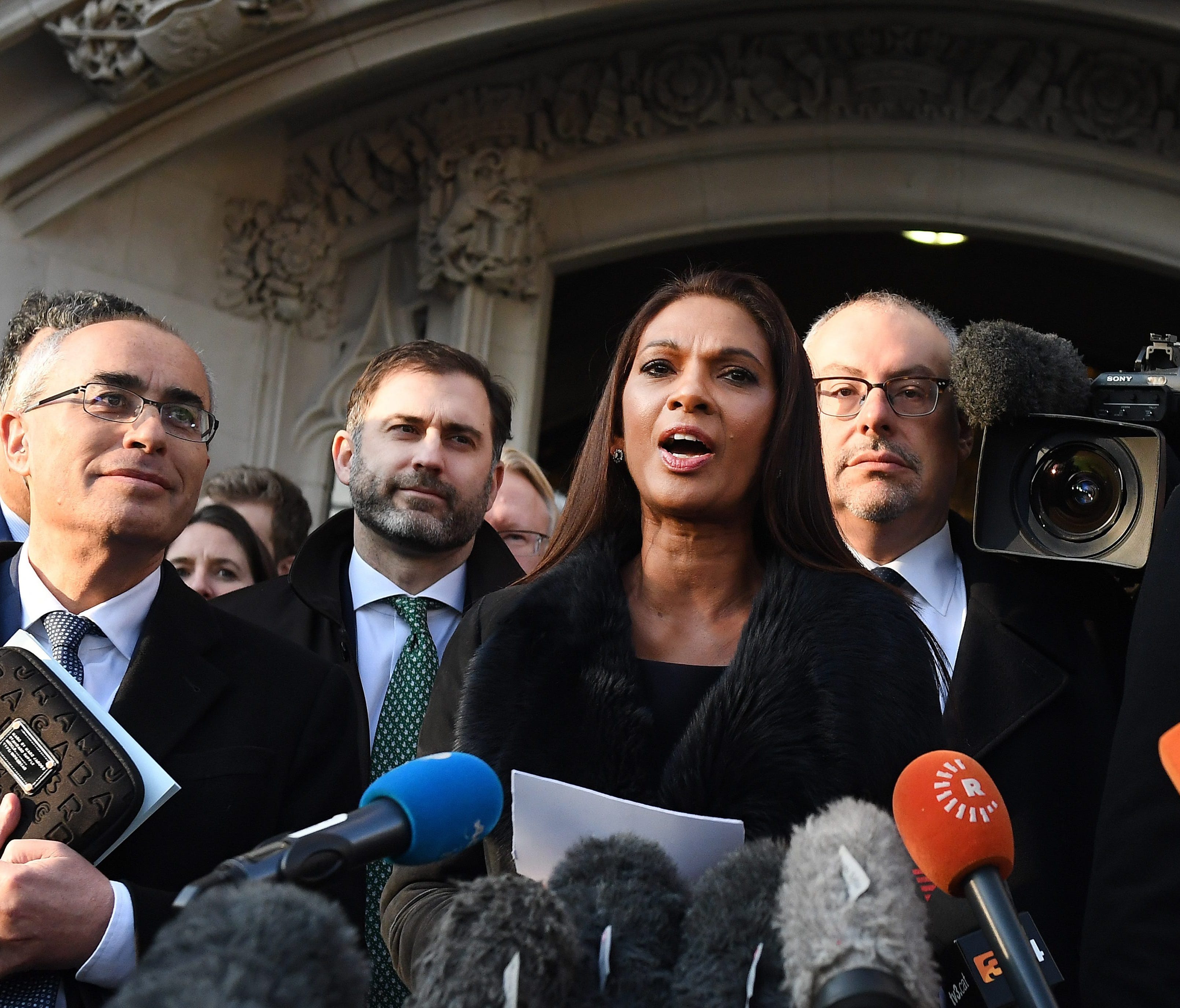Lead claimant in the Article 50 case, Gina Miller (center) delivers a statement outside the Supreme Court in London, Jan. 24,  2017.