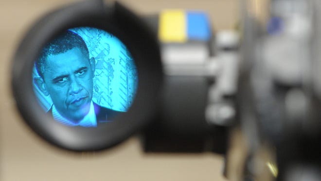 President Obama, as seen through the eyepiece of a television camera.