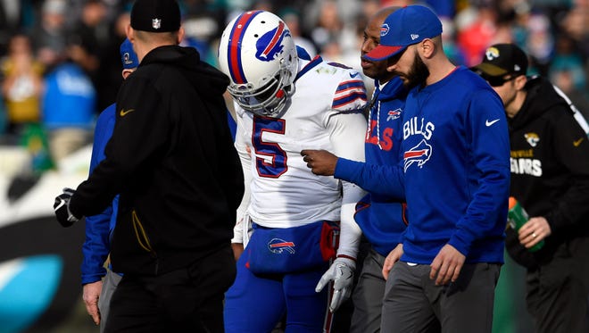 Jan 7, 2018; Jacksonville, FL, USA; Buffalo Bills quarterback Tyrod Taylor (5) walks off the field after being injured during the fourth quarter against the Jacksonville Jaguars in the AFC Wild Card playoff football game at EverBank Field. Mandatory Credit: Tommy Gilligan-USA TODAY Sports