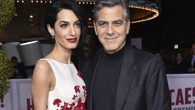 Amal and George Clooney have announced that their Clooney Foundation for Justice is supporting the Southern Poverty Law Center with a $1 million grant to combat hate groups in the United States.