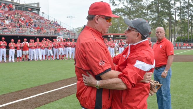 UL coach Tony Robichaux, left, hugs his father, Ray Robichaux, as Chris Russo looks on before the Cajuns beat Southern 5-4 Saturday at M.L. "Tigue" Moore Field at Russo Park.