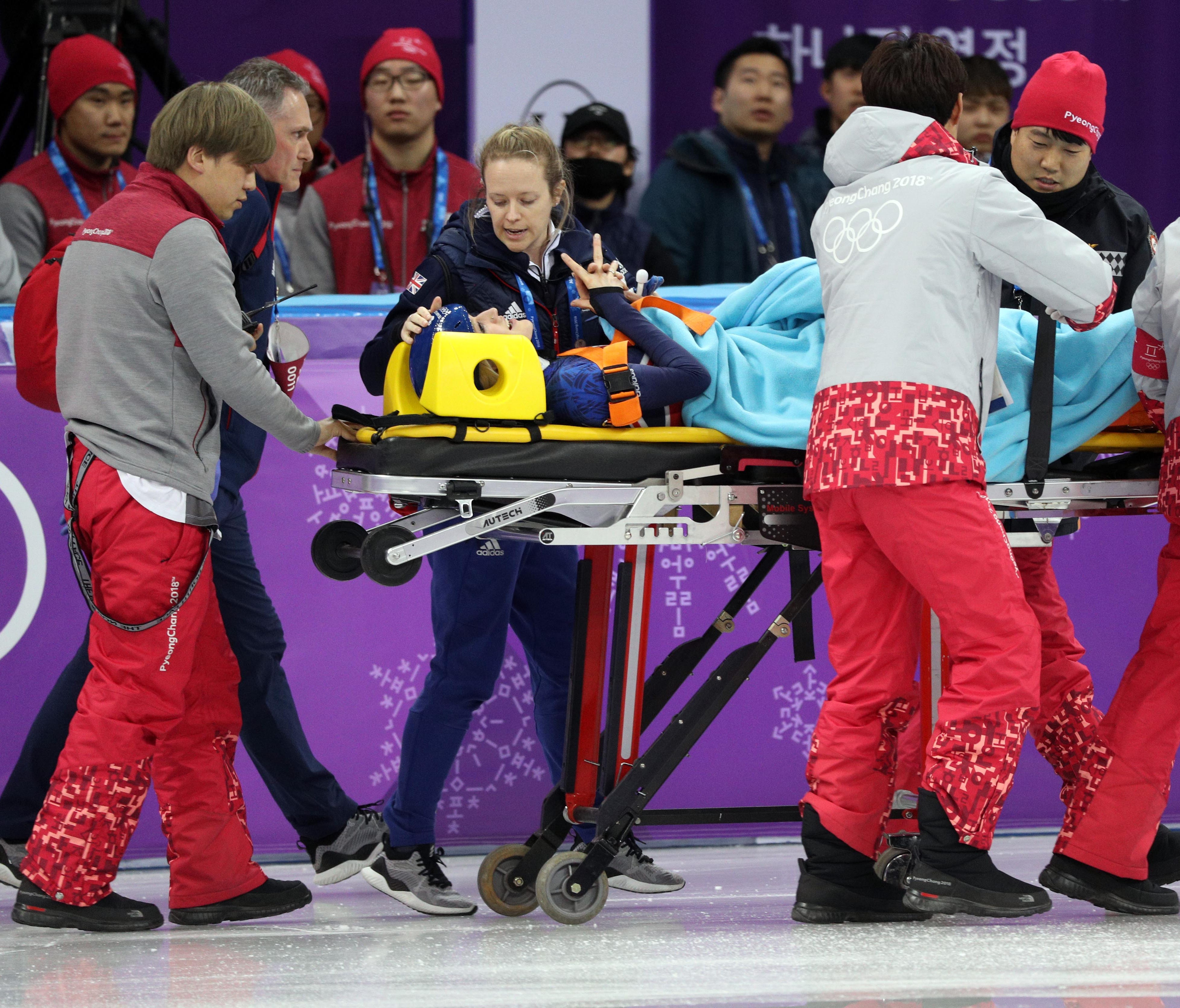 Feb 17, 2018; Pyeongchang, South Korea; Elise Christie (GBR) is brought  off the ice on a stretcher after a crash in the short track speed skating ladies 1,500m semifinals during the Pyeongchang 2018 Olympic Winter Games at Gangneung Ice Arena. Manda