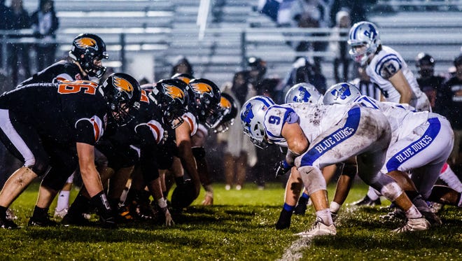 Hartford faces off against visiting Whitefish Bay during a rain soaked game on Friday, Oct. 13, 2017.