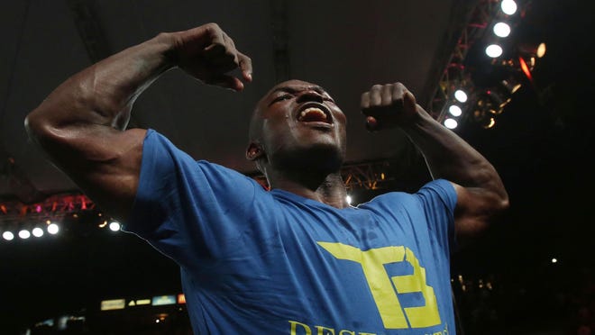 Timothy Bradley celebrates his win against Jessie Vargas at the StubHub Center in Carson on June 27. Bradley won by unanimous decision and is the new WBO welterweight champion.