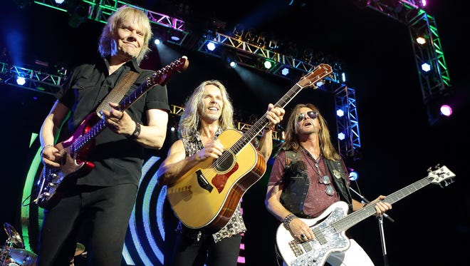 From left: James Young, Tommy Shaw and Ricky Phillips of the band Styx perform in concert during the Soundtrack of Summer Tour 2014 at the Susquehanna Bank Center in Camden, N.J. in July 2014.