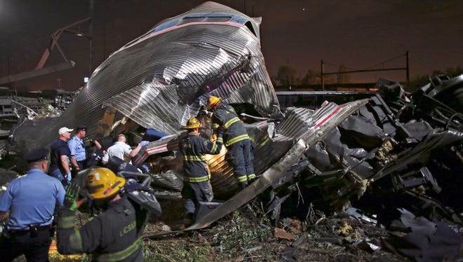Emergency personnel work May 12, 2015, at the scene of a derailed Amtrak train in Philadelphia.