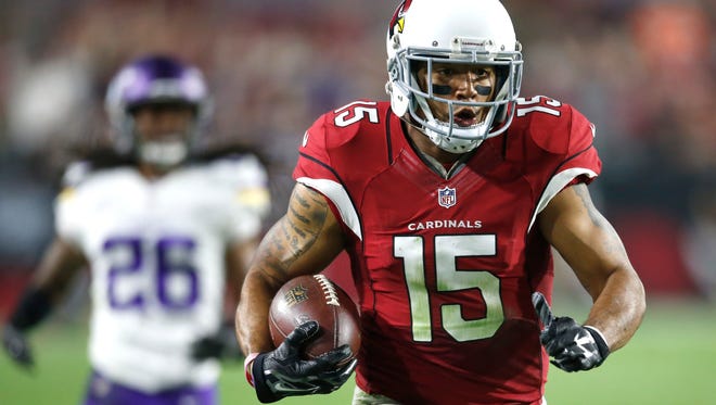 Cardinals wide receiver Michael Floyd runs in for a TD on Dec. 10, 2015 in Glendale against the Vikings.