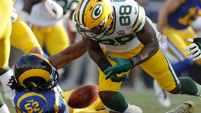 Green Bay Packers running back Ty Montgomery (88) fumbles the ball, recovered by Los Angeles Rams linebacker Ramik Wilson (52) during the second half of an NFL football game, Sunday, Oct. 28, 2018, in Los Angeles. (AP Photo/Marcio Jose Sanchez)