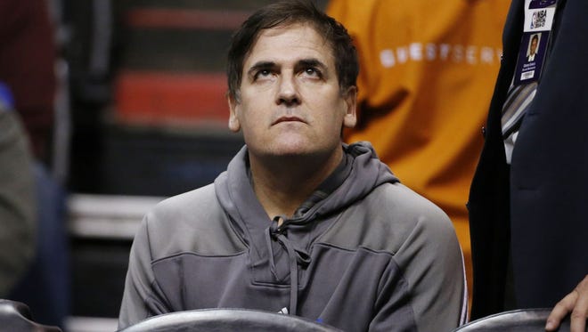 Dallas Mavericks owner Mark Cuban looks up at the scoreboard during a game between the Mavericks and Phoenix Suns in 2014.
