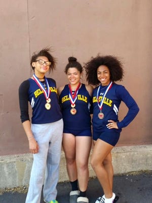 From left, Nichole Henry, Kiara Collazo and Brianna Miranda stand with their fifth place medals won at the Morris Hills Relays in the discus relay event.