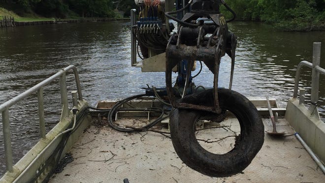 Tom Melancon removes tires from the Bayou Vermilion. One reason tires end up in the water is the misconception that they make good “holes” or artificial habitats for catfishing, according to Bayou Vermilion District’s Water Quality Coordinator Emile Ancelet. Bayou Vermilion offers myriad ideas to repurpose tires on its Pinterest board. Find it at pinterest.com/bayouvermilion.